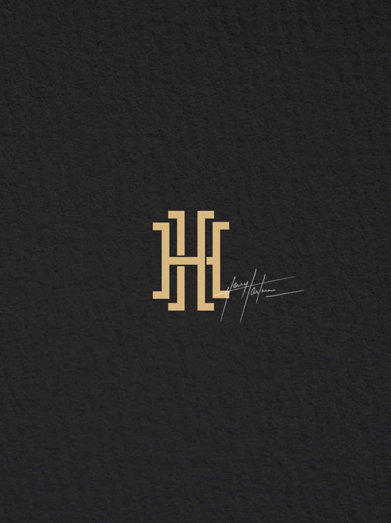Harry Hartman logo in gold on black page 